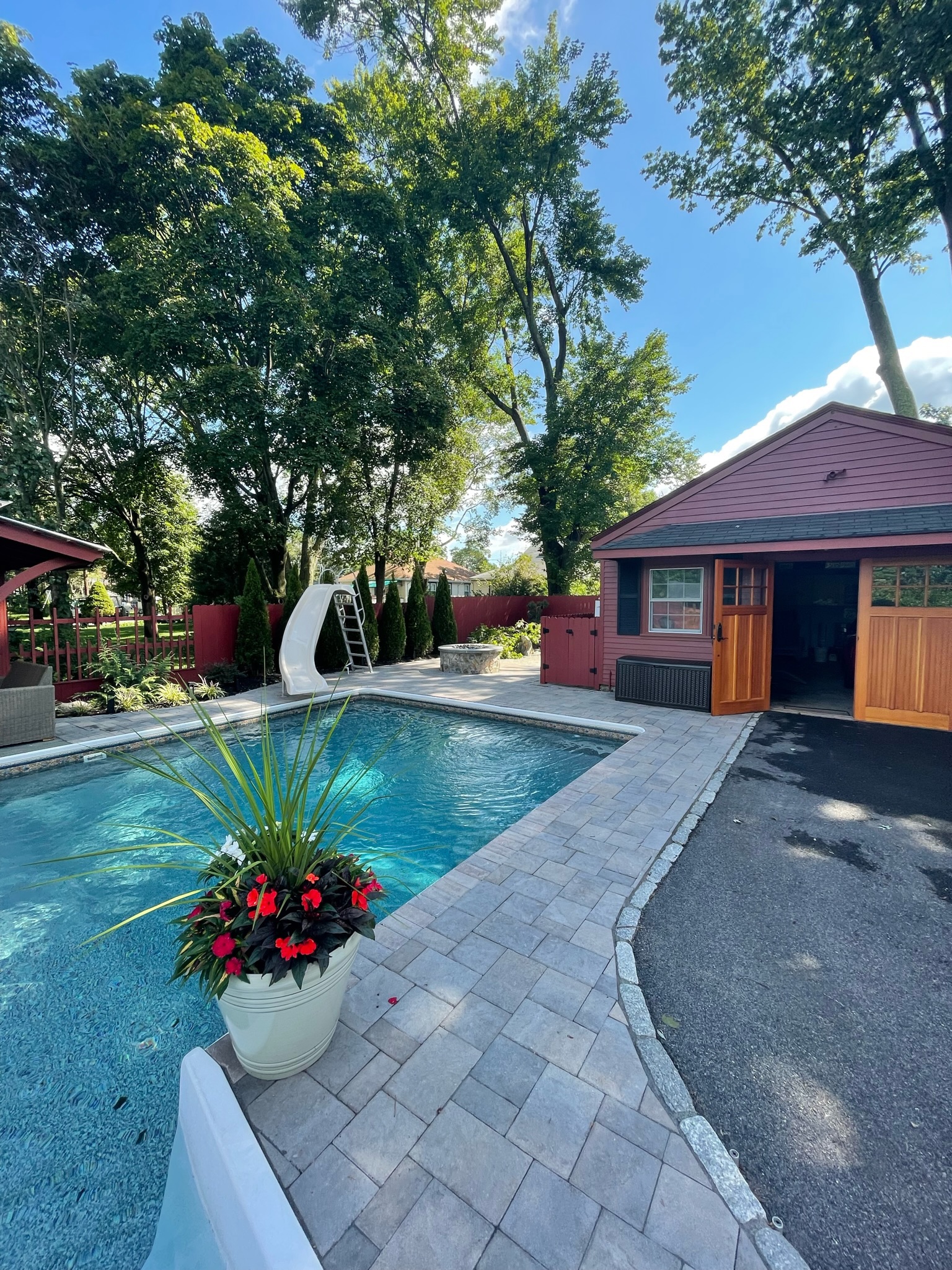 House and pool with stone paver walkway